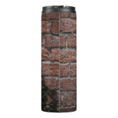 Pflanze mit grüner Blattfarbe in der Nähe der Back Thermosbecher (Rückseite)
