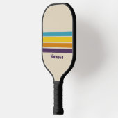 Pflaumenstauscher über Streifen mit Namen Pickleball Schläger (Links)