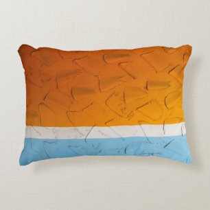 Photo of orange, white, and blue artwork dekokissen