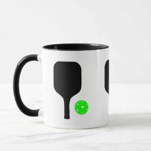 Pickleball-Paddle und grüner Ball Tasse