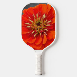 Pickleball-Schläger mit einer orangefarbenen Blume Pickleball Schläger