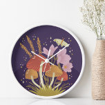 Pilz mit Florals Lila Uhr<br><div class="desc">Mushroom mit Florals Lila Illustration Features eine schöne und trendige Pilz-Illustration mit Pilzen, Blumen, und einem niedlichen Schmetterling in lila Rosa und Orange Farbtönen, eine schöne Ergänzung zu Ihrem Büro oder Ihrer Wohngestaltung Original Kunstwerk von Ana Garza/Kardz Studio Alle Fragen oder Wünsche, kontaktieren Sie mich über den Zazzle Chat oder...</div>