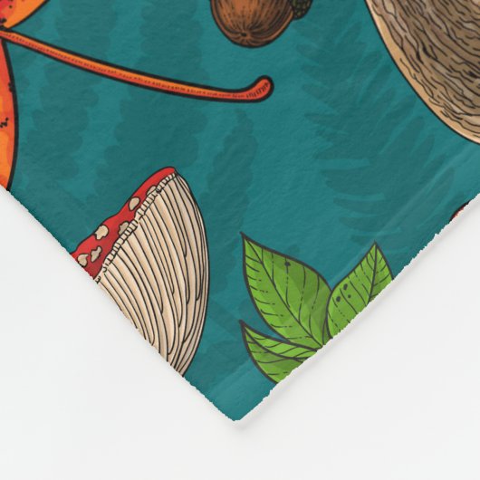 Pilze, Blätter, Nüsse und Beeren im Herbst auf bla Fleecedecke (Ecke)