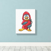 Pinguin als Feuerwehrmann mit Löschgerät Leinwanddruck (Insitu (Holzboden))