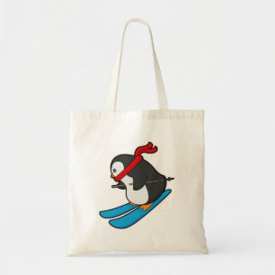Pinguin als Skifahrer mit Ski Tragetasche