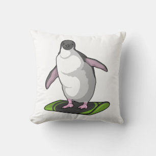 Pinguin als Snowboarder mit Snowboard Kissen