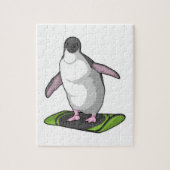 Pinguin als Snowboarder mit Snowboard Puzzle (Vertikal)