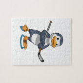 Pinguin beim Eishockey mit Eishockeyschläger Puzzle (Horizontal)