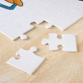 Pinguin beim Eishockey mit Eishockeyschläger Puzzle (Seite)