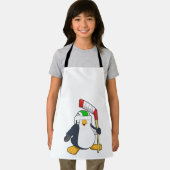 Pinguin beim Eishockey mit Eishockeyschläger Schürze (Insitu)