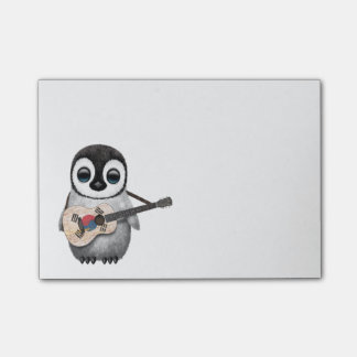 Pinguin, der südkoreanische Flaggen-Gitarre spielt Post-it Klebezettel