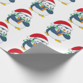 Pinguin in einem Weihnachtshut mit Geschenk Geschenkpapier (Ecke)