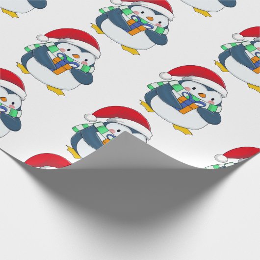 Pinguin in einem Weihnachtshut mit Geschenk Geschenkpapier (Ecke)