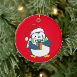 Pinguin in einem Weihnachtshut mit Geschenk Keramik Ornament