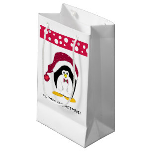 Pinguin in einer Weihnachtsmannmütze Kleine Geschenktüte