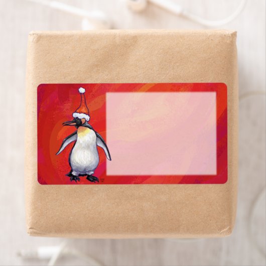 Pinguin in Weihnachtsmannmütze auf Rot (Insitu)