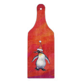 Pinguin in Weihnachtsmannmütze auf Rot Schneidebrett (Vorderseite)