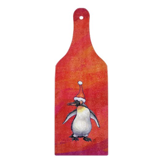 Pinguin in Weihnachtsmannmütze auf Rot Schneidebrett (Vorderseite)