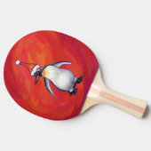 Pinguin in Weihnachtsmannmütze auf Rot Tischtennis Schläger (Seitenansicht)
