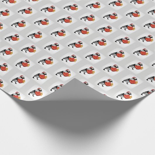 Pinguin mit Weihnachtsmannmütze und Geschenk Geschenkpapier (Ecke)