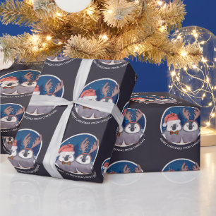 Pinguin-Paar Weihnachten Süßer Weihnachtsmann und Geschenkpapier