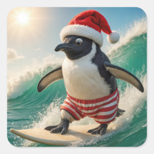 Pinguin surft auf einer Meereswelle zu Weihnachten Quadratischer Aufkleber