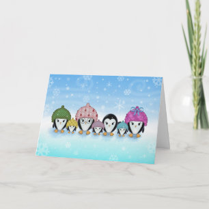 Pinguine in der Schnee-Feiertags-Karte Feiertagskarte