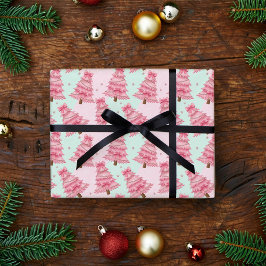 Pink Christmas trees decorated with bows. Geschenkpapier