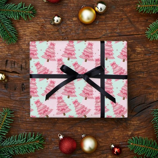 Pink Christmas trees decorated with bows. Geschenkpapier
