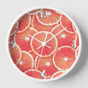 Pink grapefruit slices wanduhr