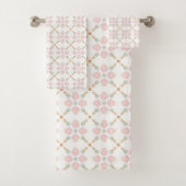 Pink petal and pastel triangle tile pattern on whi badhandtuch set (Insitu)