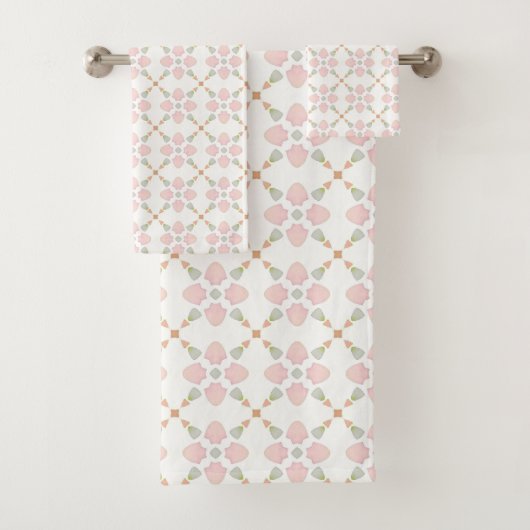 Pink petal and pastel triangle tile pattern on whi badhandtuch set (Insitu)