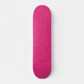 Pink textured surface with subtle swirling pattern skateboard (Vorne)