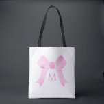 Pink Watercolor Bow Girl Monogram Tasche<br><div class="desc">Dieses Design zeichnet sich durch einen niedlichen Aquarellpinken Bogen mit Platz für einen Monogramm-Buchstaben aus. Klicken Sie auf die Schaltfläche Anpassen, um den Text zu verändern oder die Grafik zu verschieben! Variationen dieses Designs sowie der Koordinationsprodukte sind in unserem Shop, zazzle.com/store/doodlelulu, erhältlich. Kontaktieren Sie uns, wenn Sie dieses Design für...</div>