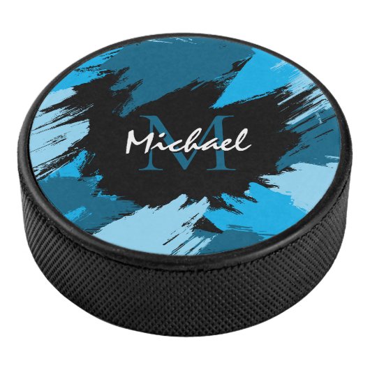 Pinselstriche in blauen Farbtönen mit Monogramm Eishockey Puck (3/4)