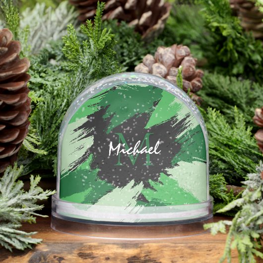 Pinselstriche in grünen Farbtönen mit Monogramm Schneekugeln (Winter)