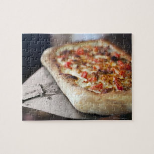 Pizza mit Tomaten, Knoblauch und Fleisch ersetzt Puzzle