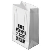 Plastikchirurg, der hart arbeitet kleine geschenktüte (Vorderseite Schrägansicht)