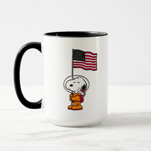 PLATZ | Snoopy mit Flaggenastronaut Tasse (Links)