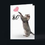 playful tabby cat for 80th birthday card karte<br><div class="desc">Gray tabby cat with pink heart balloon for 80th birthday on white background.
Background color can be changed</div>