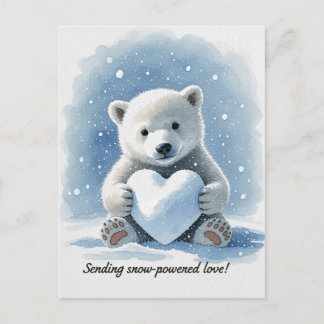 Polar bear in the snow with heart shaped snowball postkarte