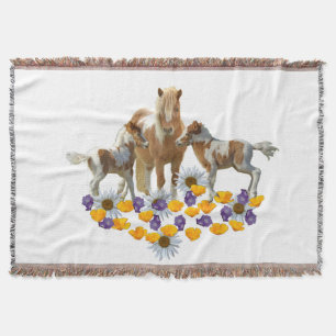 Pony Family in Blume Decke