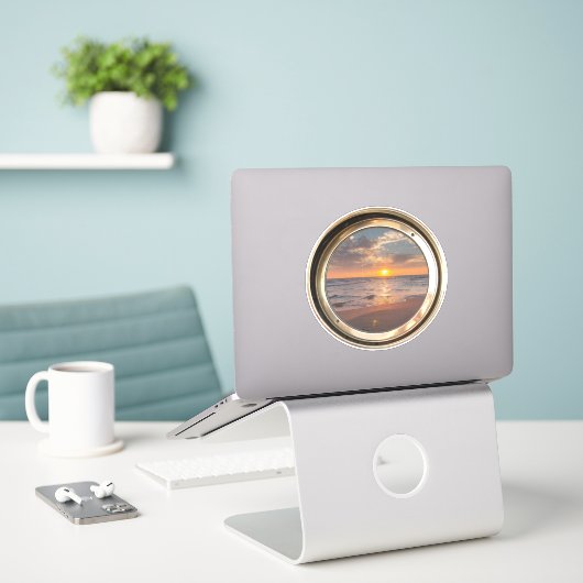 porthole with sunset aufkleber (Laptop auf Schreibtisch)