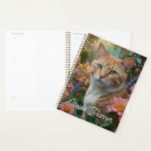 Pretty white orange cat in floral garden planer (Anzeige)