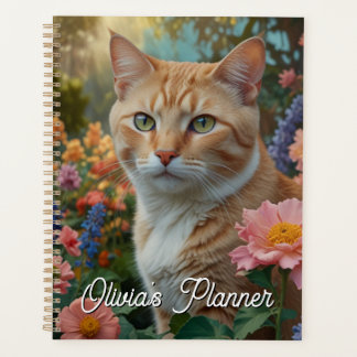 Pretty white orange cat in floral garden planer