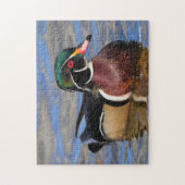 Profil einer handlichen Holzente am Wasser Puzzle (Vertikal)