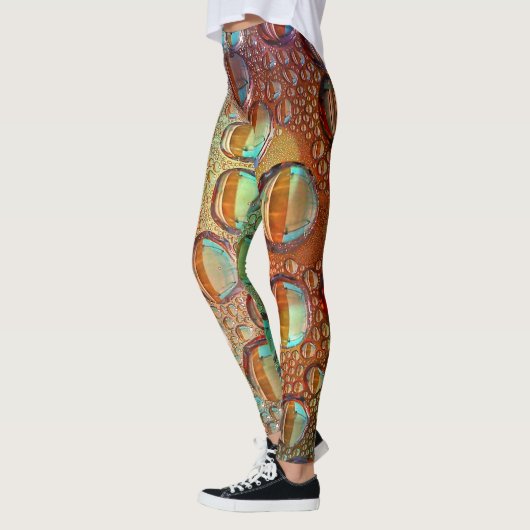 Psychedelische, hellblaue und orangefarbene Wasser Leggings (Links)