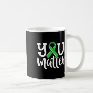 Psychische Gesundheit von Frauen Ihr Problem grüne Kaffeetasse