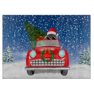 Pudel fährt Auto im Schnee Weihnachten  Schneidebrett
