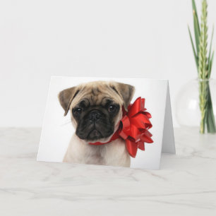 Pug Puppy Wrapped in a Christmas Bow Feiertagskarte